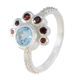 Ling silver ring with blue center stone and garnet accents jeweled halo colorful party wear fashion ring